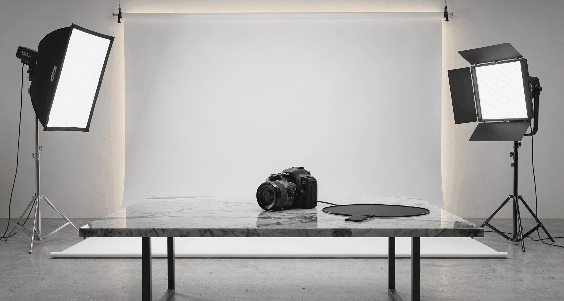 Professional automotive photography setup in a bright showroom studio